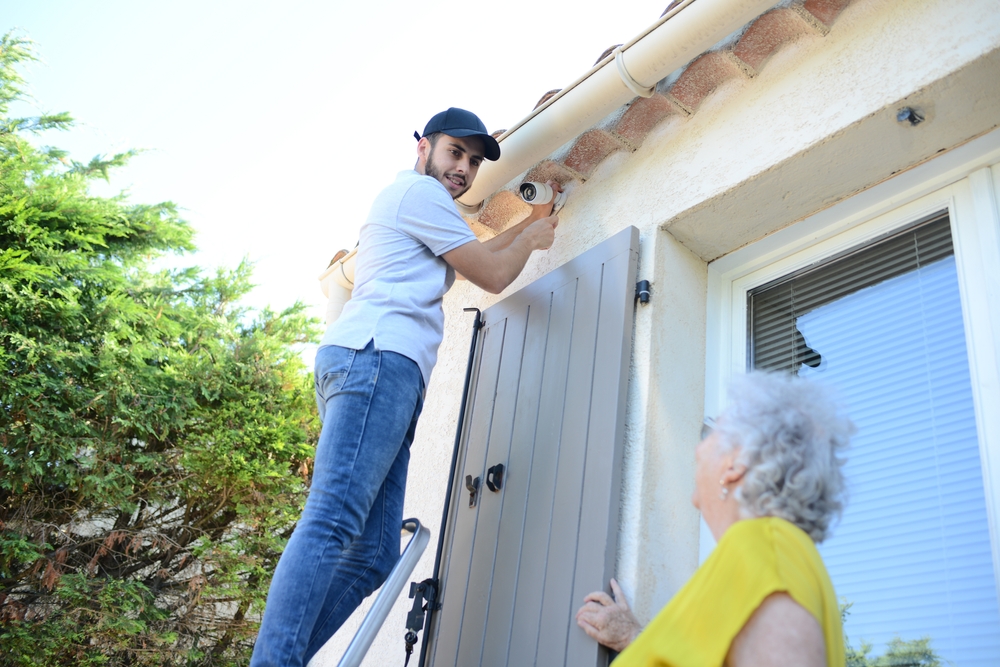 Handsome,Young,Man,Installing,House,Security,Anti,Burglary,Camera,And